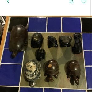 Turtle of different materials, stone and wood.